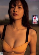 A woman in a bikini posing for a magazine.